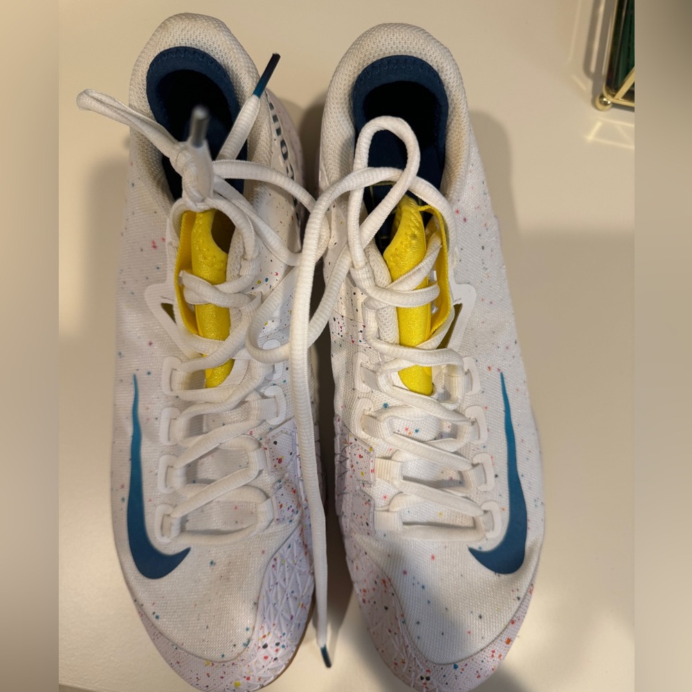 Nike White Athletic Shoes with Blue Swoosh and Yellow Tongue